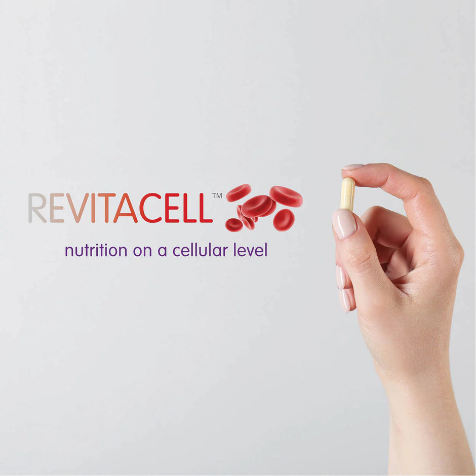 hand holding a capsule next to narrative Revitacell nutrition on a cellular level